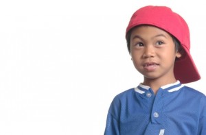 cute young boy in red baseball cap